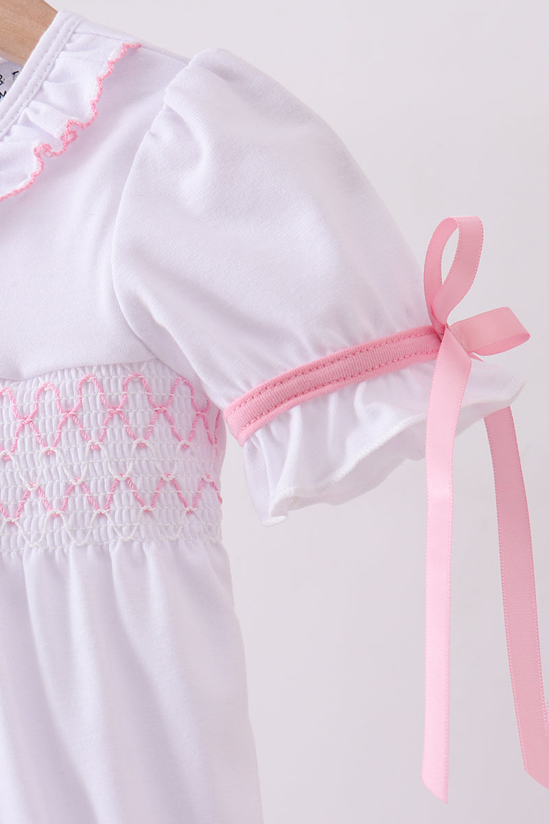 White cross smocked ruffle bubble