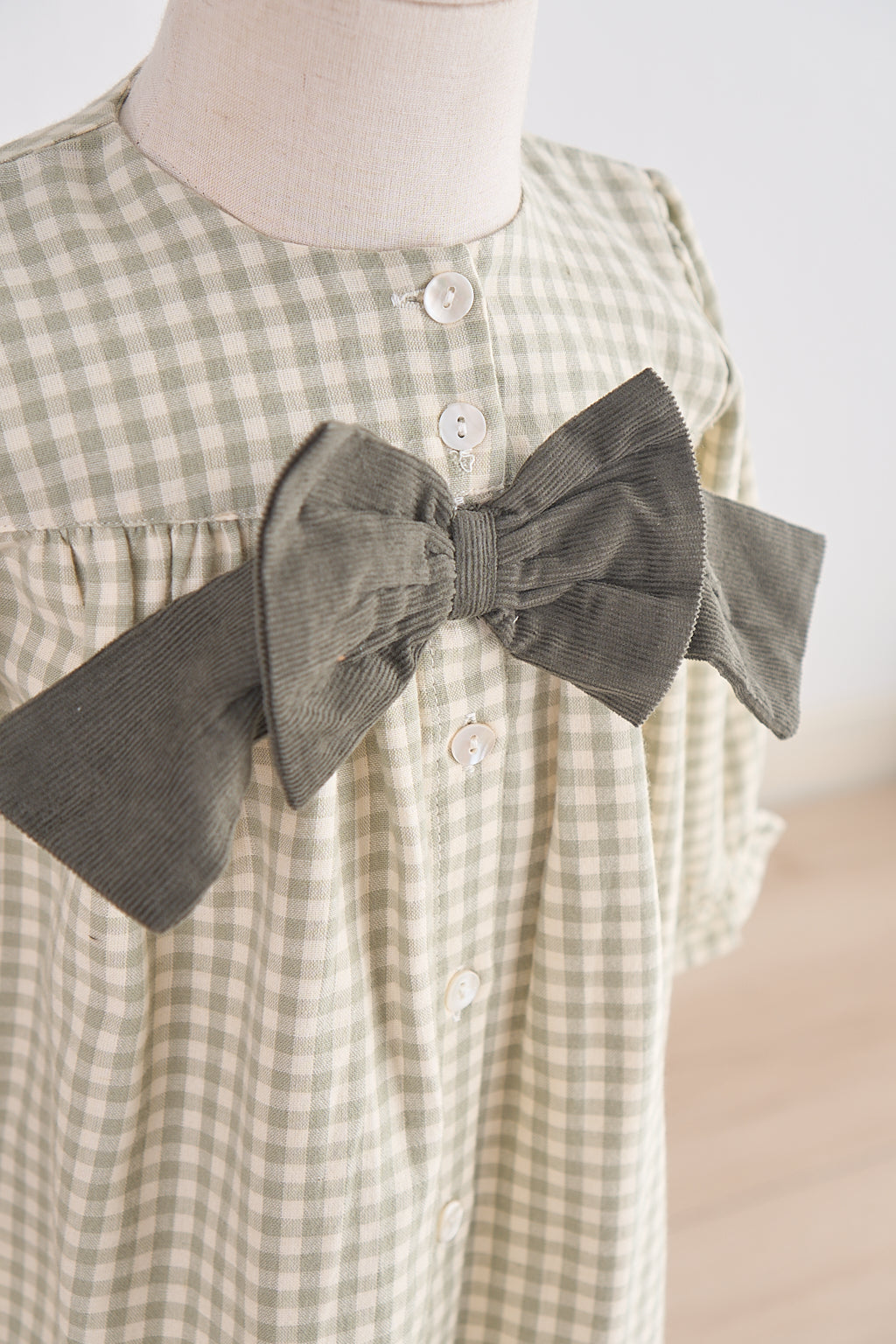 Green gingham flannel bow dress