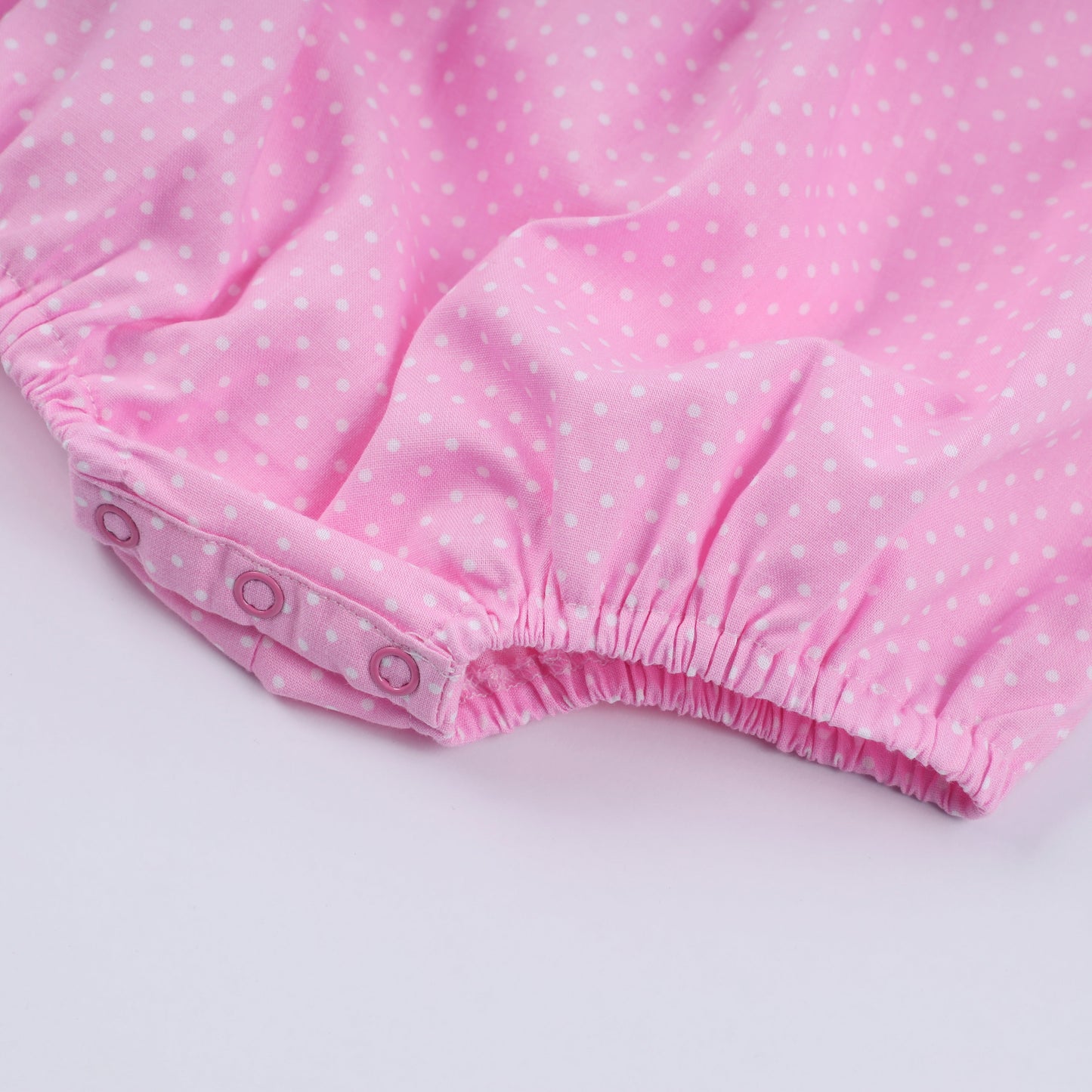 Pink character hand smocked dot ruffle bubble